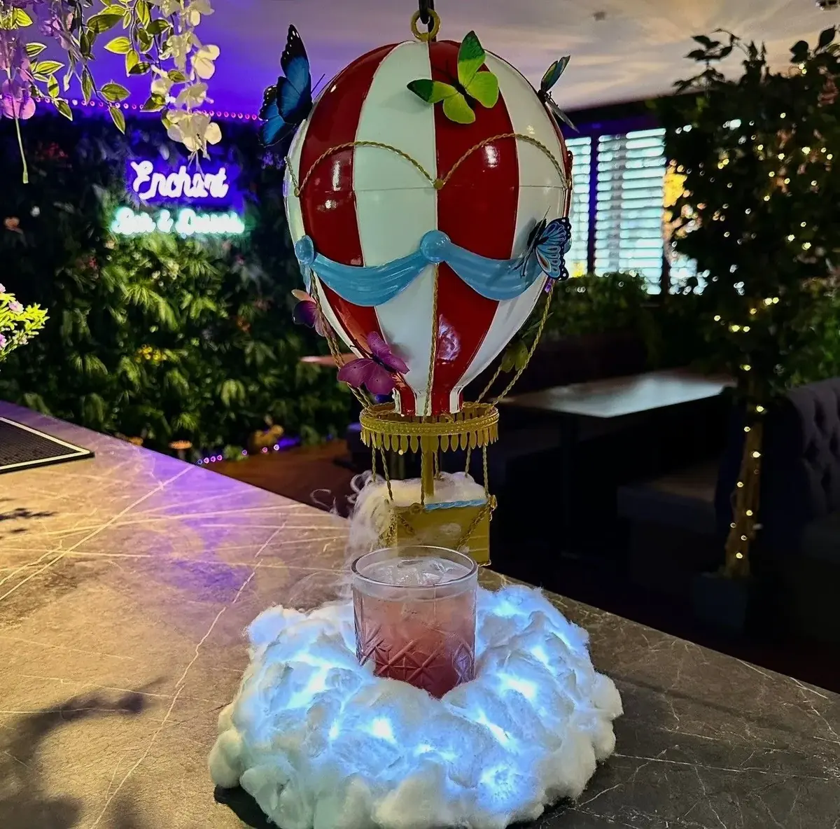 Hot air balloon cocktail surrounded by candyfloss at Enchant